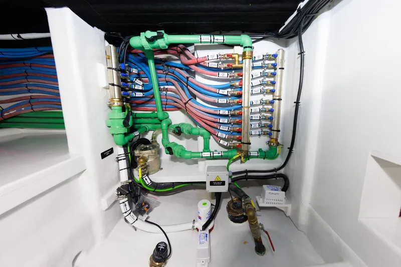 Mona Lisa Yacht Photos Pics Engine room piping system of 2025 Vicem 58 Classic yacht, featuring organized colored tubes.
