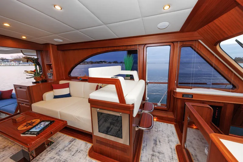 Mona Lisa Yacht Photos Pics Luxurious interior of 2025 Vicem 58 Classic yacht with elegant wood finish and waterfront view.