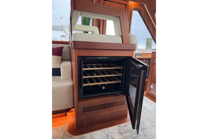 Mona Lisa Yacht Photos Pics Luxurious interior of 2025 Vicem 58 Classic yacht with open wine cooler.