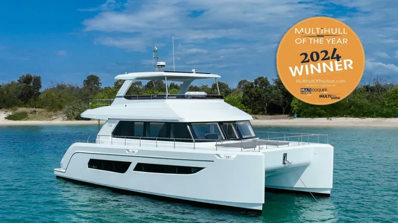 53f Iliad 2025 Yacht Photos Pics Luxury ILIAD 53F yacht, 2024 Multihull of the Year winner, cruising in clear waters.