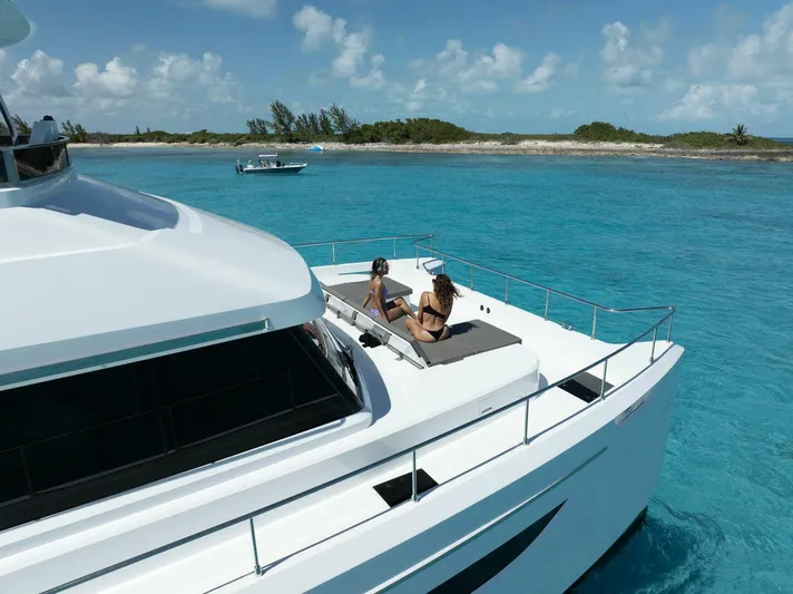 53f Iliad 2025 Yacht Photos Pics Luxury ILIAD 53F yacht cruising in turquoise waters, 2026 model.