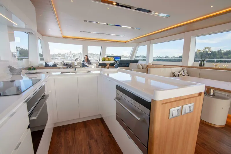 53f Iliad 2025 Yacht Photos Pics Luxurious interior of 2026 ILIAD 53F yacht with modern kitchen and panoramic windows.