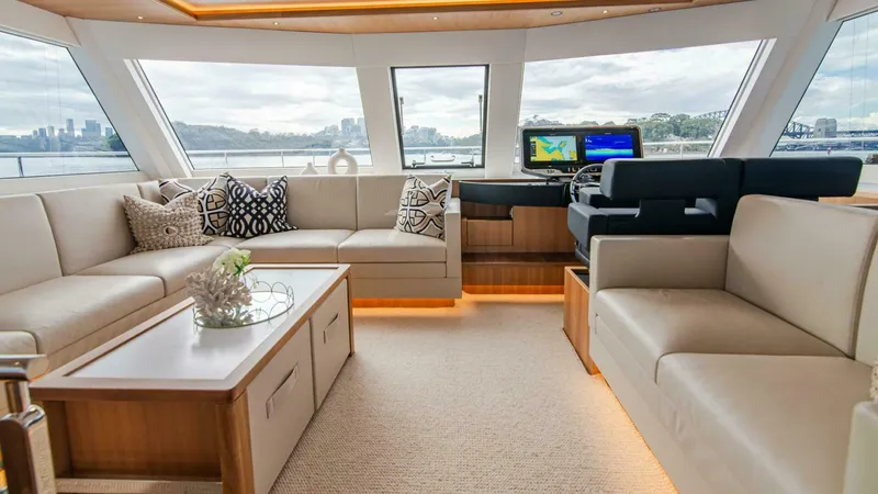 53f Iliad 2025 Yacht Photos Pics Luxurious interior of 2026 ILIAD 53F yacht with plush seating and navigation equipment.