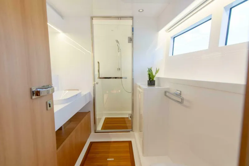53f Iliad 2025 Yacht Photos Pics Modern yacht bathroom with wooden accents, glass shower, and sleek design in ILIAD 53F, 2026 model.