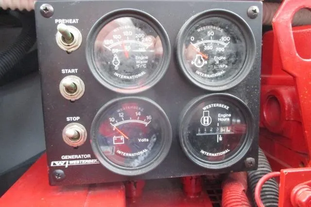 Pho-king-gross Yacht Photos Pics Control panel of a 2002 Sea Ray 400 Sedan Bridge generator with gauges and switches.
