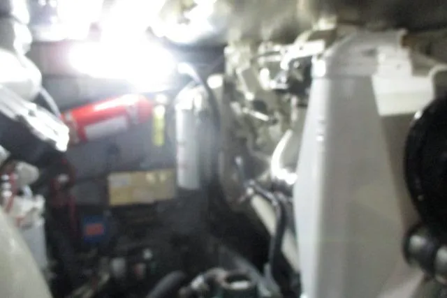 Pho-king-gross Yacht Photos Pics Engine room of 2002 Sea Ray 400 Sedan Bridge with visible equipment and components.