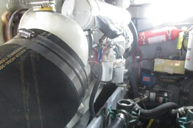 Pho-king-gross Yacht Photos Pics Engine room of a 2002 Sea Ray 400 Sedan Bridge with visible components and fire extinguisher.