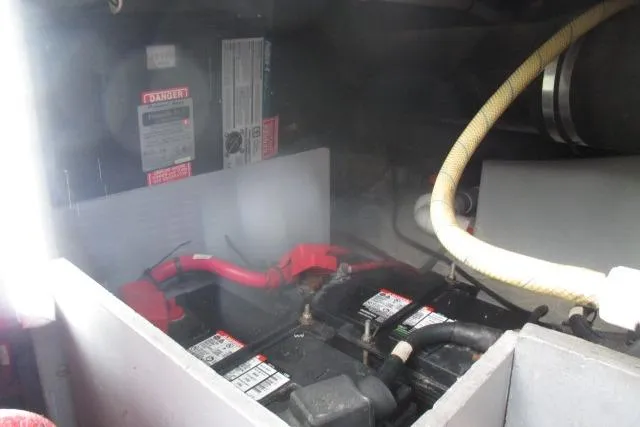 Pho-king-gross Yacht Photos Pics Battery compartment of a 2002 Sea Ray 400 Sedan Bridge with visible wiring and labels.