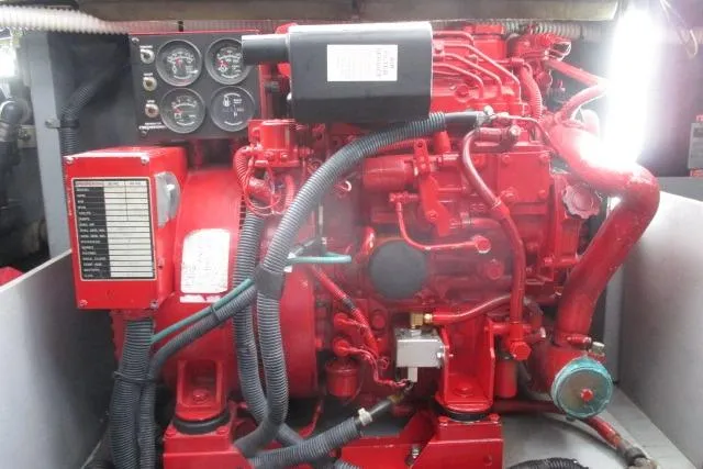 Pho-king-gross Yacht Photos Pics Red engine of a 2002 Sea Ray 400 Sedan Bridge with gauges and wiring.