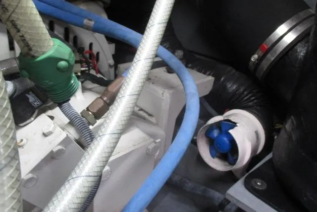 Pho-king-gross Yacht Photos Pics Engine compartment of 2002 Sea Ray 400 Sedan Bridge with hoses and components visible.