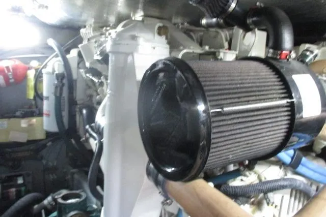 Pho-king-gross Yacht Photos Pics Engine room of 2002 Sea Ray 400 Sedan Bridge with visible air filter and components.