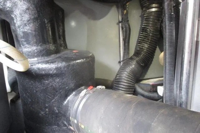 Pho-king-gross Yacht Photos Pics Engine compartment of a 2002 Sea Ray 400 Sedan Bridge with hoses and fittings.