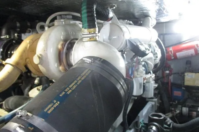 Pho-king-gross Yacht Photos Pics Engine room of 2002 Sea Ray 400 Sedan Bridge with visible components and piping.