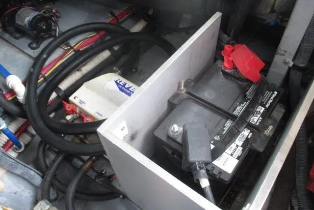 Pho-king-gross Yacht Photos Pics Battery compartment of a 2002 Sea Ray 400 Sedan Bridge with wiring and components.