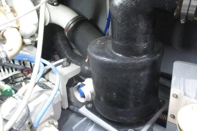 Pho-king-gross Yacht Photos Pics Engine compartment of a 2002 Sea Ray 400 Sedan Bridge with visible components and hoses.