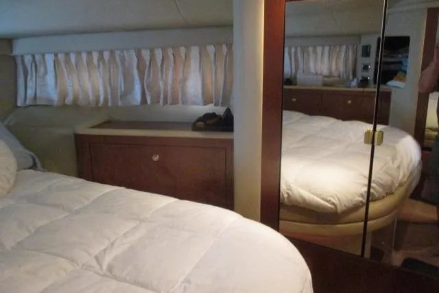 Pho-king-gross Yacht Photos Pics Interior cabin of 2002 Sea Ray 400 Sedan Bridge with bed and mirrored closet.