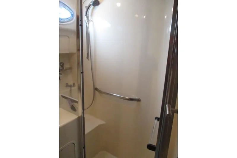 Pho-king-gross Yacht Photos Pics Shower area in 2002 Sea Ray 400 Sedan Bridge yacht, featuring sleek design and modern fixtures.