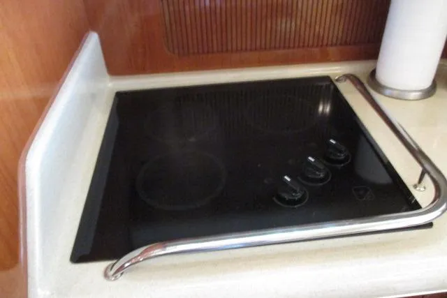 Pho-king-gross Yacht Photos Pics Stovetop in 2002 Sea Ray 400 Sedan Bridge yacht kitchen area.