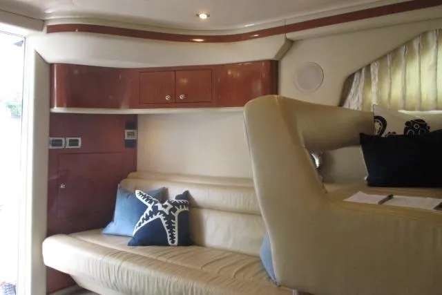Pho-king-gross Yacht Photos Pics Luxurious interior of 2002 Sea Ray 400 Sedan Bridge yacht with plush seating and stylish decor.