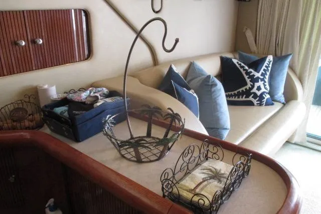 Pho-king-gross Yacht Photos Pics Luxurious interior of 2002 Sea Ray 400 Sedan Bridge with elegant seating and decor.