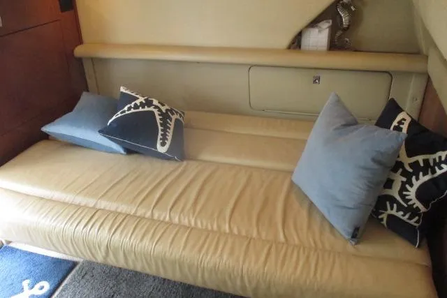 Pho-king-gross Yacht Photos Pics Interior of 2002 Sea Ray 400 Sedan Bridge with beige seating and decorative pillows.