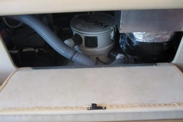 Pho-king-gross Yacht Photos Pics Engine compartment of a 2002 Sea Ray 400 Sedan Bridge with visible hoses and components.