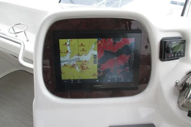 Pho-king-gross Yacht Photos Pics Garmin navigation display on 2002 Sea Ray 400 Sedan Bridge yacht dashboard.