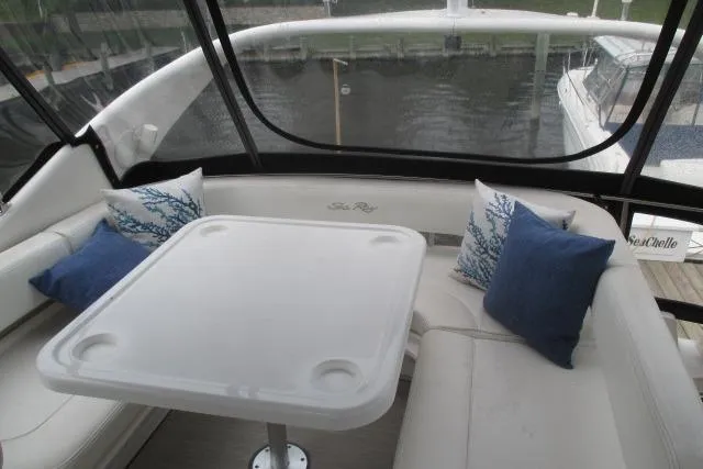 Pho-king-gross Yacht Photos Pics 2002 Sea Ray 400 Sedan Bridge interior with white seating and decorative pillows.