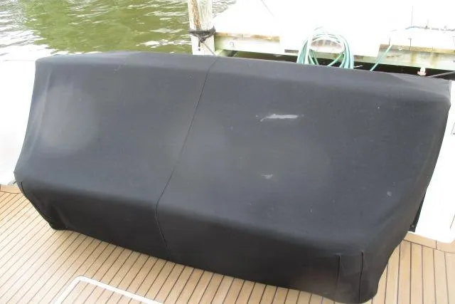 Pho-king-gross Yacht Photos Pics Black cover on a 2002 Sea Ray 400 Sedan Bridge boat deck.