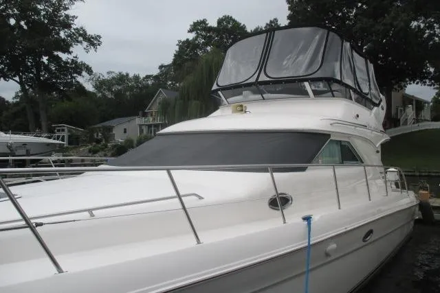Pho-king-gross Yacht Photos Pics 2002 Sea Ray 400 Sedan Bridge yacht docked, featuring sleek design and spacious flybridge.