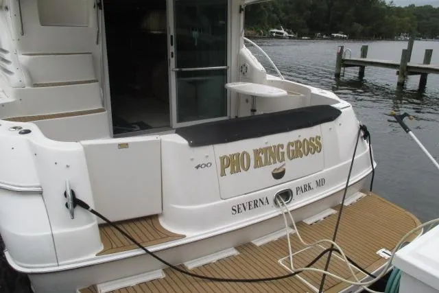 Pho-king-gross Yacht Photos Pics 2002 Sea Ray 400 Sedan Bridge docked, featuring "Pho King Cross" nameplate.