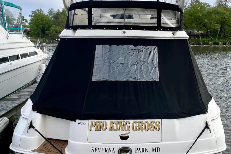 Pho-king-gross Yacht Photos Pics 2002 Sea Ray 400 Sedan Bridge docked, featuring custom name and cover, Severna Park, MD.