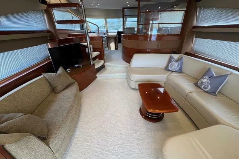  Yacht Photos Pics Luxurious interior of a 2006 Princess 67 Flybridge yacht with elegant seating and modern decor.
