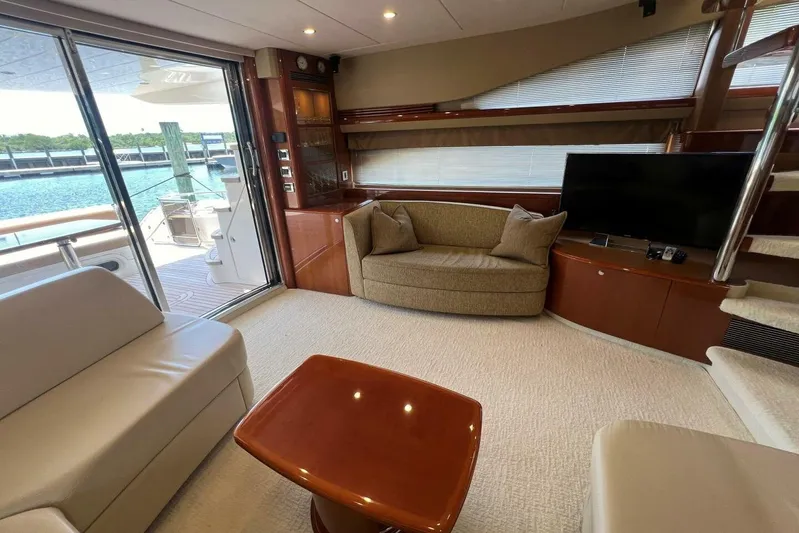 Yacht Photos Pics Luxurious interior of 2006 Princess 67 Flybridge yacht with elegant seating and modern amenities.
