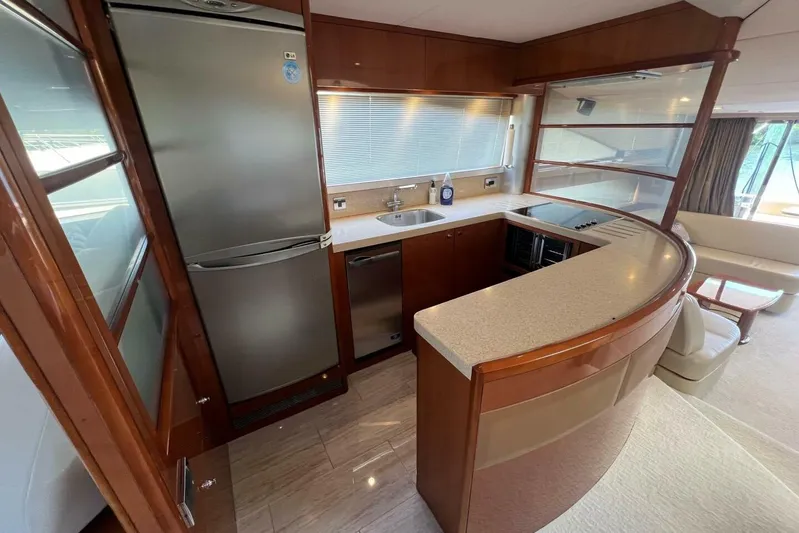  Yacht Photos Pics Luxurious kitchen interior of 2006 Princess 67 Flybridge yacht with modern appliances.