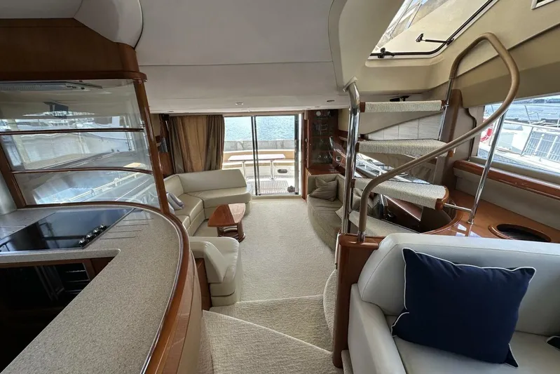  Yacht Photos Pics Luxurious interior of 2006 Princess 67 Flybridge yacht with elegant seating and modern design.