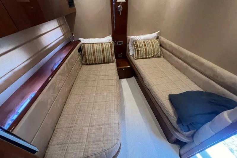  Yacht Photos Pics Interior of 2006 Princess 67 Flybridge yacht with twin beds and elegant decor.