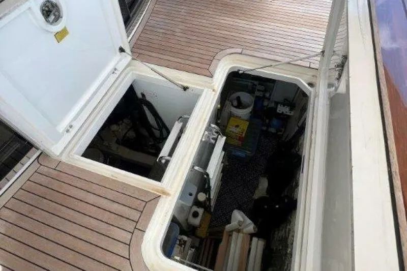 Yacht Photos Pics Open hatch on 2006 Princess 67 Flybridge yacht, revealing storage compartment.