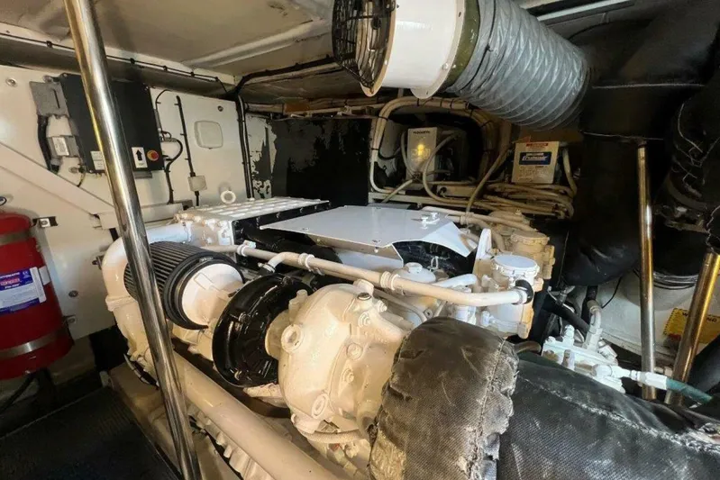  Yacht Photos Pics Engine room of a 2006 Princess 67 Flybridge yacht, showcasing mechanical components.