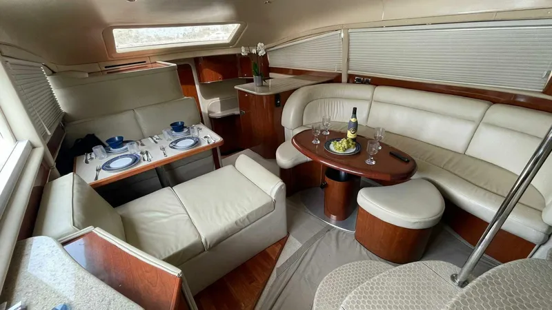 Zoto Yacht Photos Pics Luxurious interior of 2003 Sea Ray 390 Motor Yacht with elegant dining and seating area.