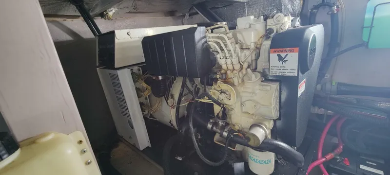 Zoto Yacht Photos Pics Engine room of a 2003 Sea Ray 390 Motor Yacht, showcasing mechanical components.