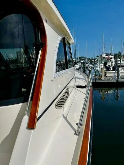 Linda Lou Yacht Photos Pics Legacy 36 yacht, 2018 model, docked at marina with clear blue sky.