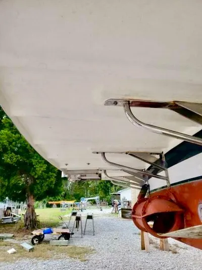 Linda Lou Yacht Photos Pics 2018 Legacy 36 boat hull in dry dock, showcasing undercarriage and propeller.