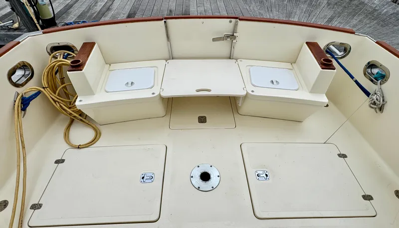 Linda Lou Yacht Photos Pics 2018 Legacy 36 boat deck with storage compartments and seating.