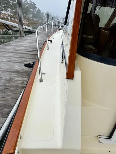 Linda Lou Yacht Photos Pics 2018 Legacy 36 boat docked, showcasing side deck and railing.