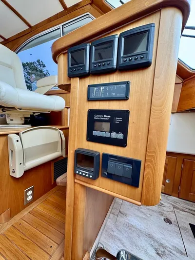 Linda Lou Yacht Photos Pics Control panel of a 2018 Legacy 36 boat with multiple displays and switches.