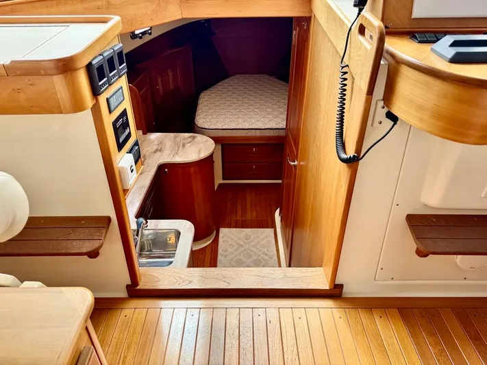 Linda Lou Yacht Photos Pics Interior of 2018 Legacy 36 boat with wood finish and cozy cabin space.