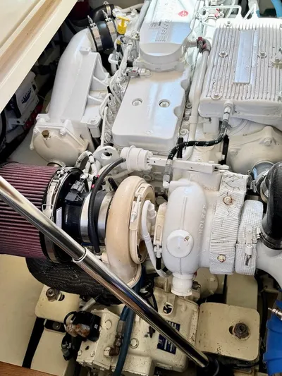 Linda Lou Yacht Photos Pics Engine compartment of a 2018 Legacy 36 boat, showcasing detailed mechanical components.