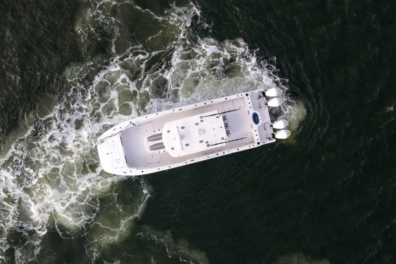 Nordic Blue Yacht Photos Pics Aerial view of 2024 Invincible 35 Catamaran navigating through ocean waves.