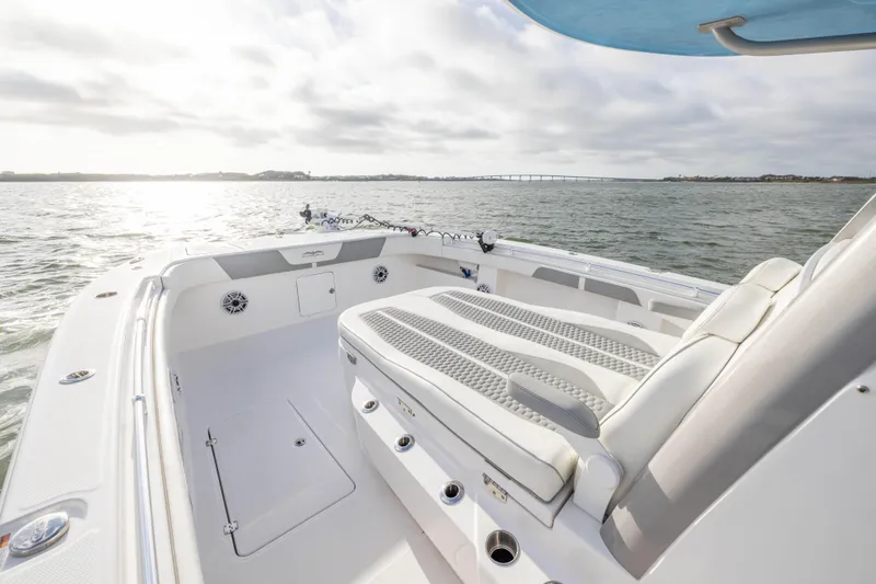 Nordic Blue Yacht Photos Pics 2024 Invincible 35 Catamaran interior with cushioned seating, on open water.